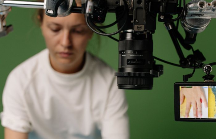 Behind the scenes of a studio shoot with a focus on video equipment and setup.