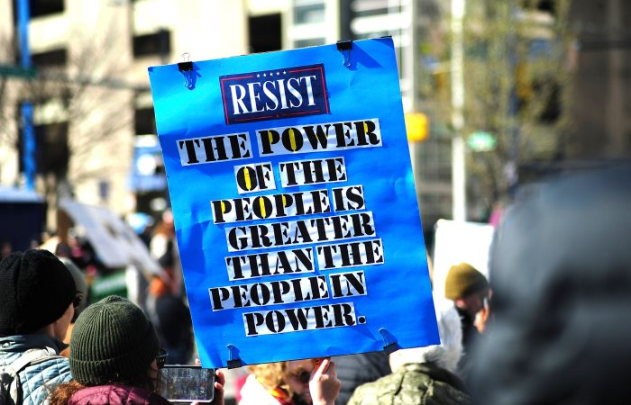 A vibrant protest in Baltimore showcasing a powerful message on people's power and resistance.